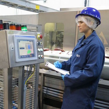 worker wearing helmet in factory